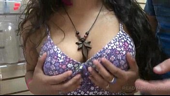 Hot brunette flashes big tits in public for cash