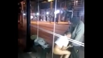 He gives a blowjob to a beggar at a bus stop