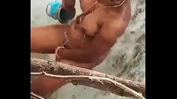 Desi aunty bathing in open place