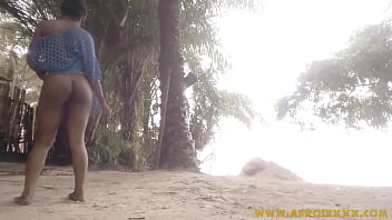 Black girl teasing on the beach